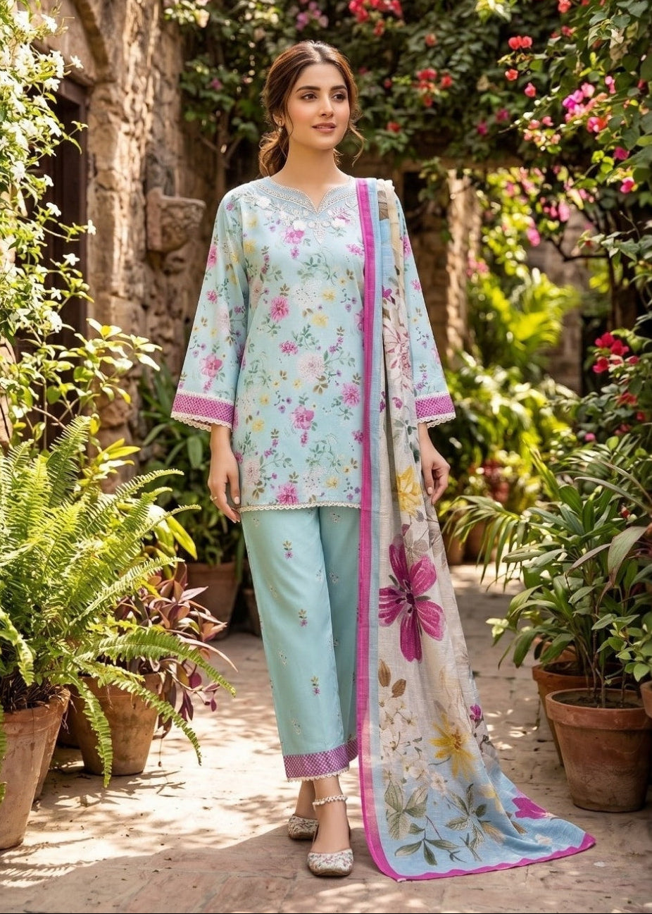 Woman in a floral dress standing in a garden with flowers and plants around.