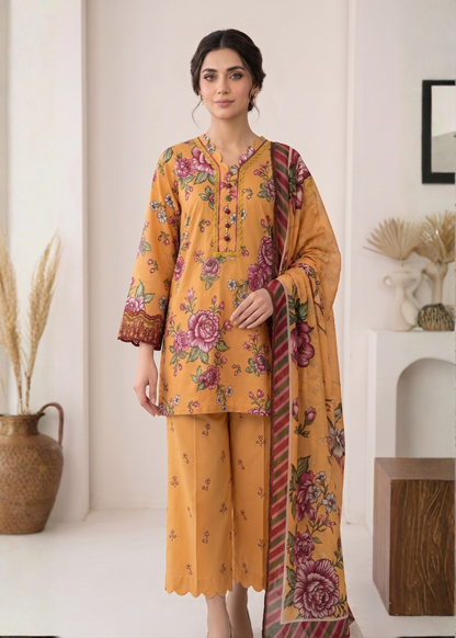 Woman wearing a mustard yellow floral outfit with a matching dupatta in a minimalistic room.